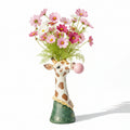 Photo circus vase girafe sur fonds blanc avec des cosmos