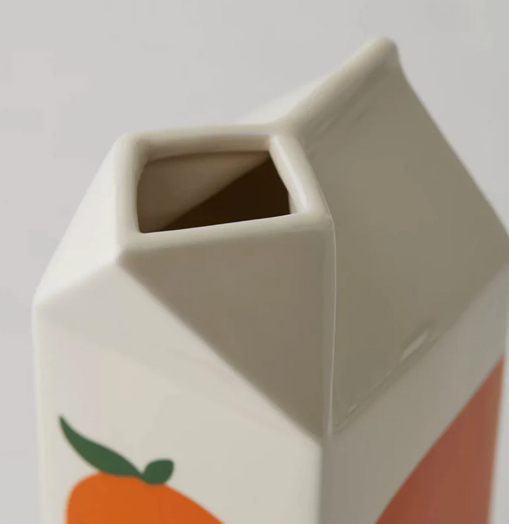 Image de zoom sur le produit vase bouteille de jus d'orange pour montrer en détail le vase